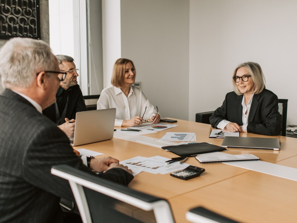 Investor partners reviewing a real estate opportunity together around a boardroom table